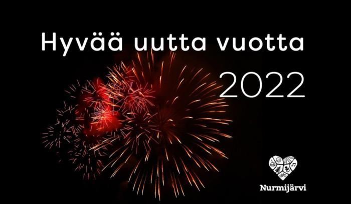 Punasävyinen raketin räjähdys mustalla pohjalla. Teksti Hyvää uutta vuootta 2022.